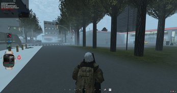 A street under the trees, pack on, gun out